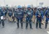 India: Tear gas dropped from drones as protesting farmers march towards New Delhi | World News