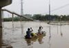 China floods: Four dead as cities submerged after days of record breaking rainfall | World News