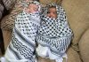 Babies held aloft at funeral of father shot dead during Israeli settler attack
