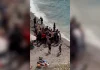 Dozens of migrants land on Spanish coast surprising beachgoers | Politics