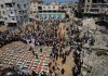 Funeral held for 112 victims buried under rubble of Gaza flats for nearly three years